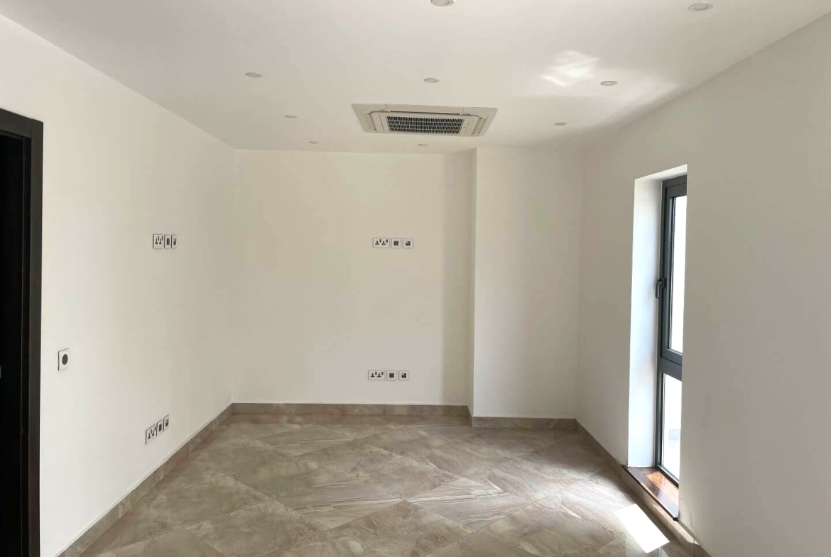 Modern living room interior with large windows and comfortable