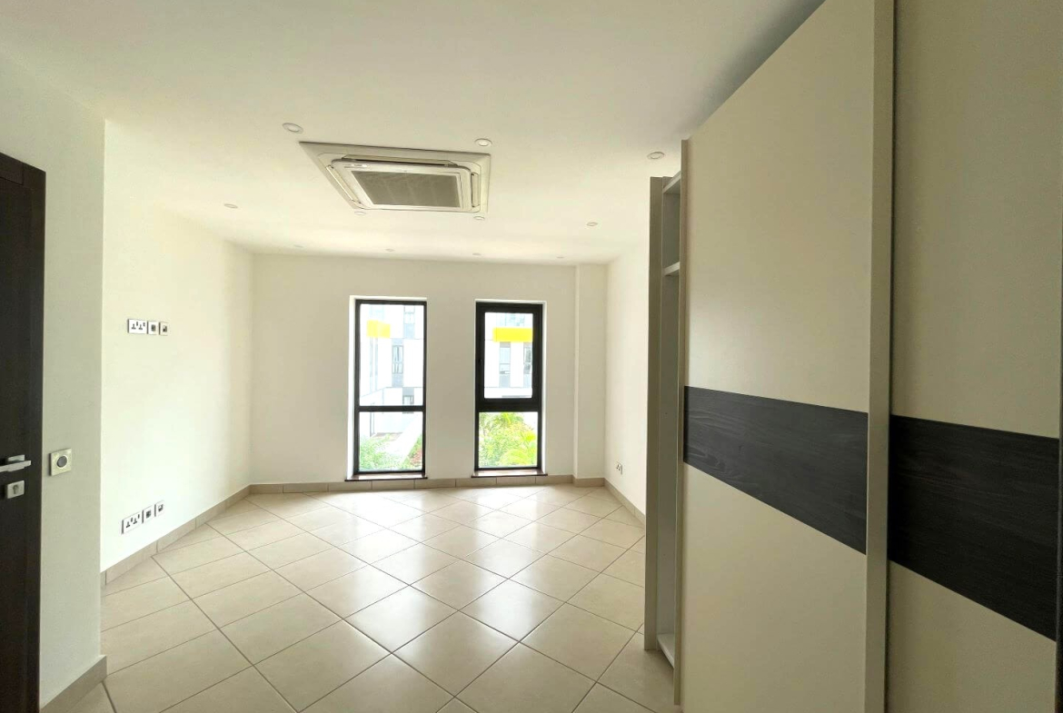 Modern living room interior with large windows and comfortable seating